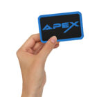 Embroidered Apex Interstellar Transport patch logo held by hand