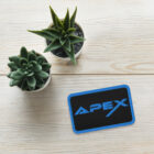 Embroidered Apex Interstellar Transport logo in blue on table with 2 succulent plants