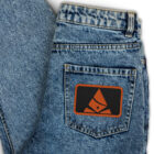 Pair of jeans with embroidered Bank of Zaonce logo in orange on back pocket