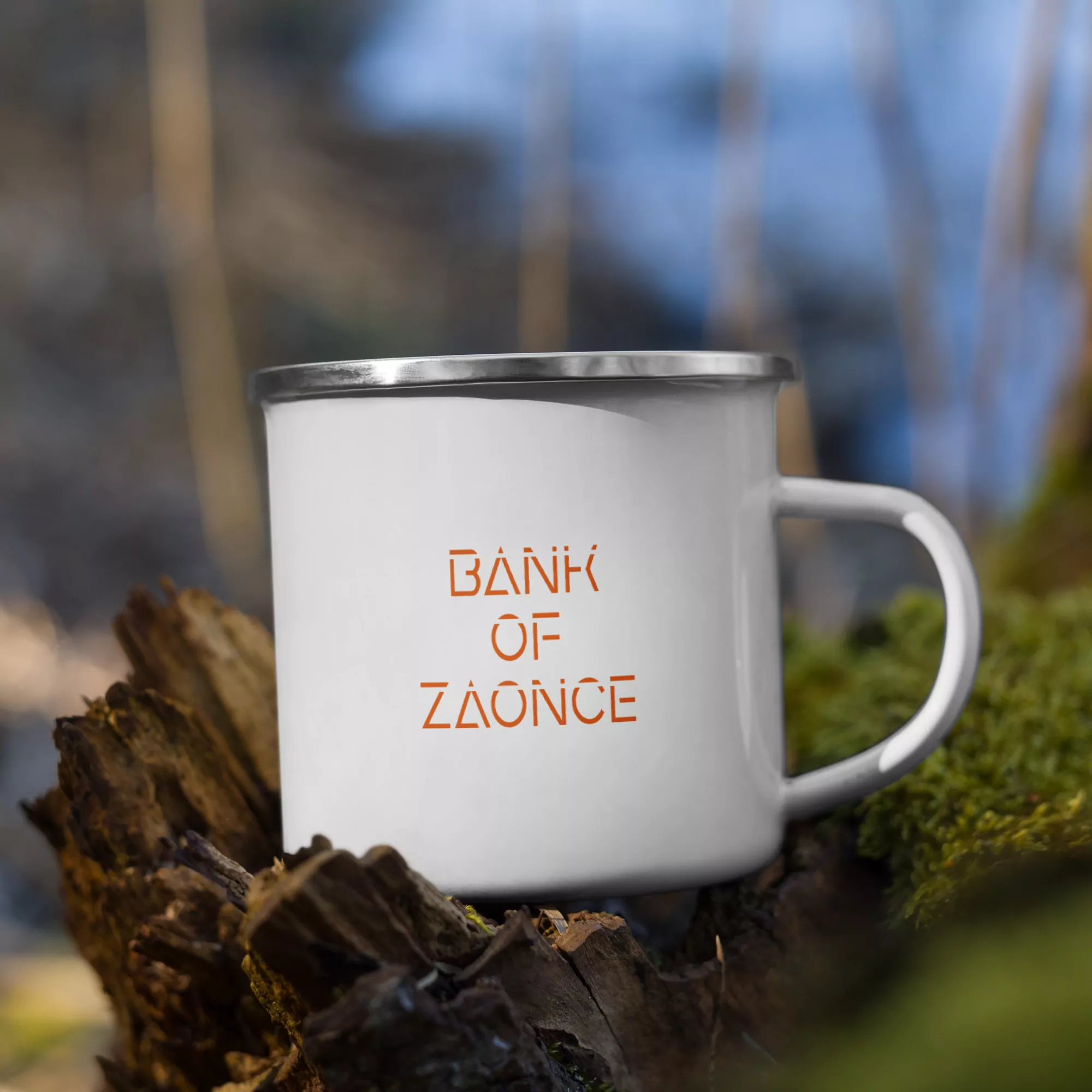 Mug with stainless steel brim and Bank of Zaonce logo in orange left side view on log