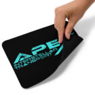 Black mousepad with Apex Interstellar Transport logo in teal blue hand pulling up corner